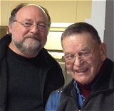 Chuck McKiernan receives an engraved gold watch from Smethport Mayor Ross Porter.