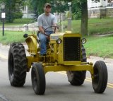 Tractor parade down Main Street in Smethport headed to fairgrounds.